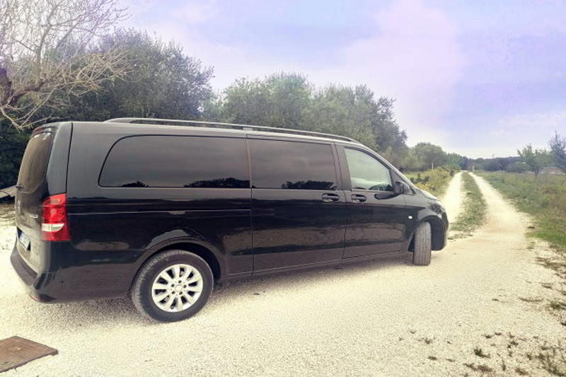 black minivan in the countryside